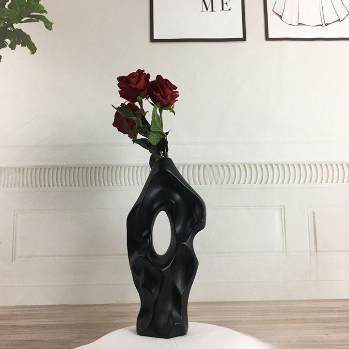 Eleanore Ceramic Vase in glossy white with a modern, curved silhouette and floral design, perfect for elegant home decor