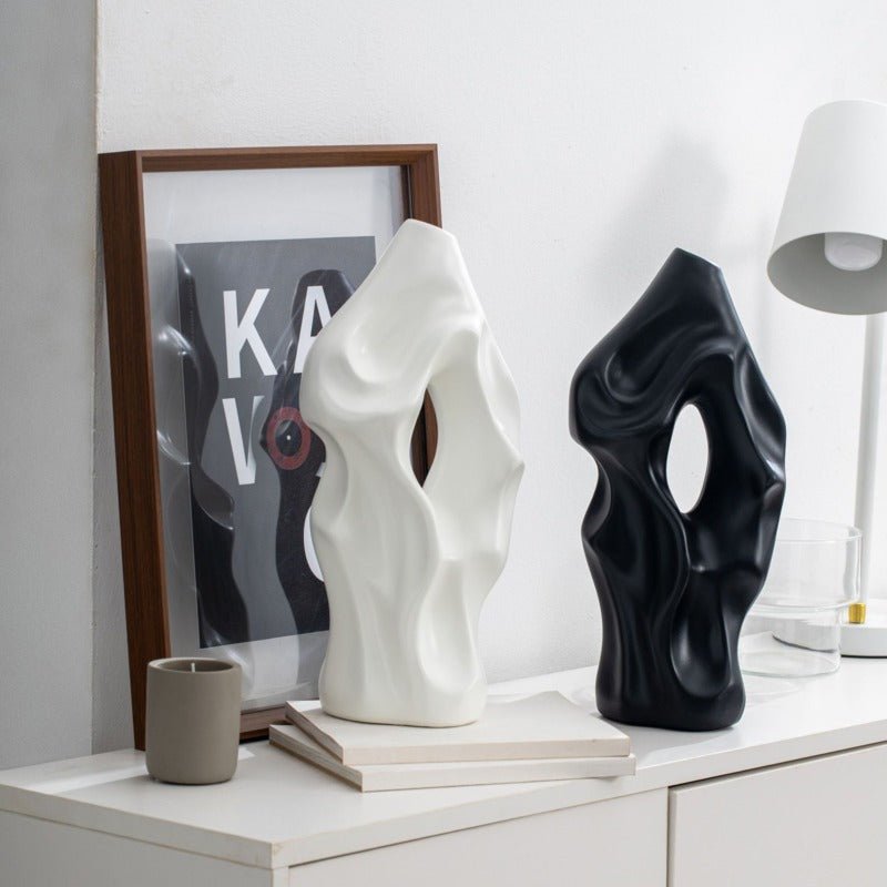 Eleanore Ceramic Vase in glossy white with a modern, curved silhouette and floral design, perfect for elegant home decor