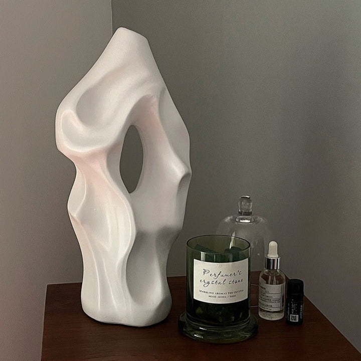 Eleanore Ceramic Vase in glossy white with a modern, curved silhouette and floral design, perfect for elegant home decor