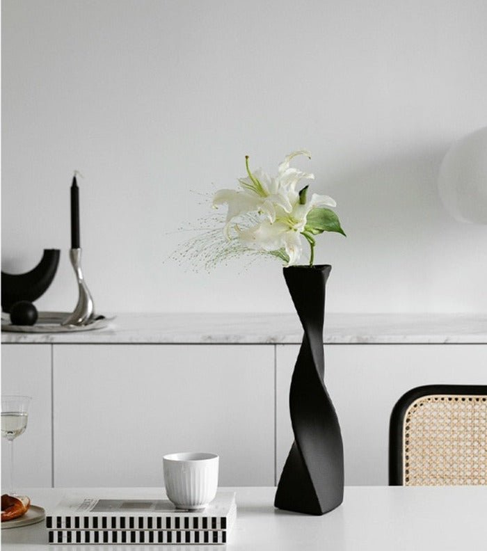 Unique Sprita Triangular Vase, featuring a sleek geometric design. Perfect for showcasing flowers or as a modern decor accent